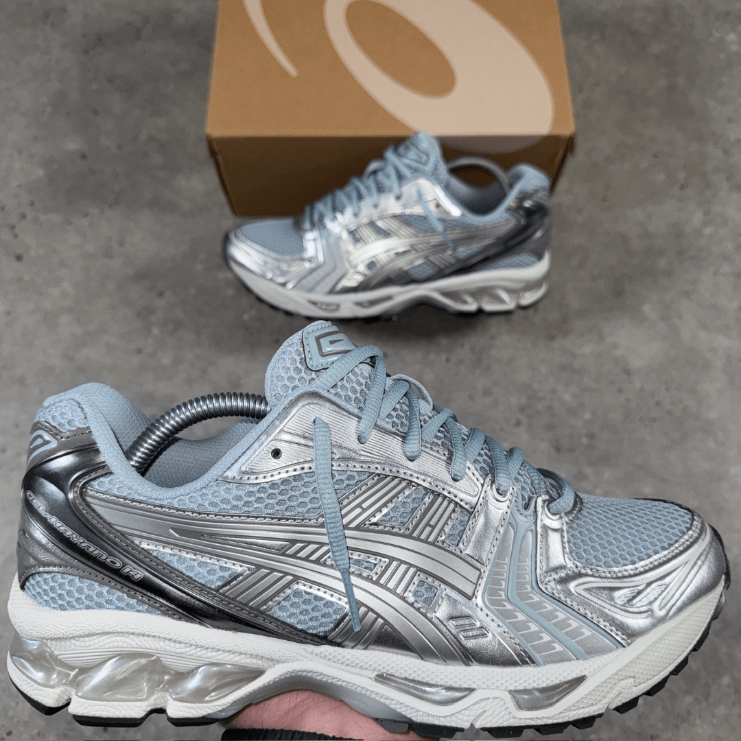 ASICS gel-kayano 14 'dolphin blue' trainers in hand